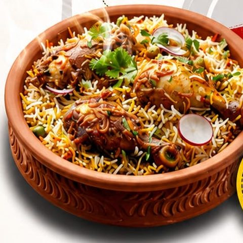 Chicken dum biryani in a clay pot